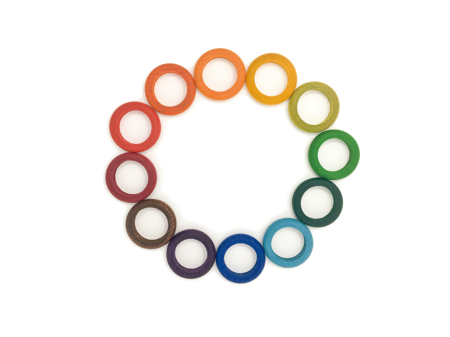 12 wooden rings in a circle, each one color of the rainbow from red to violet.